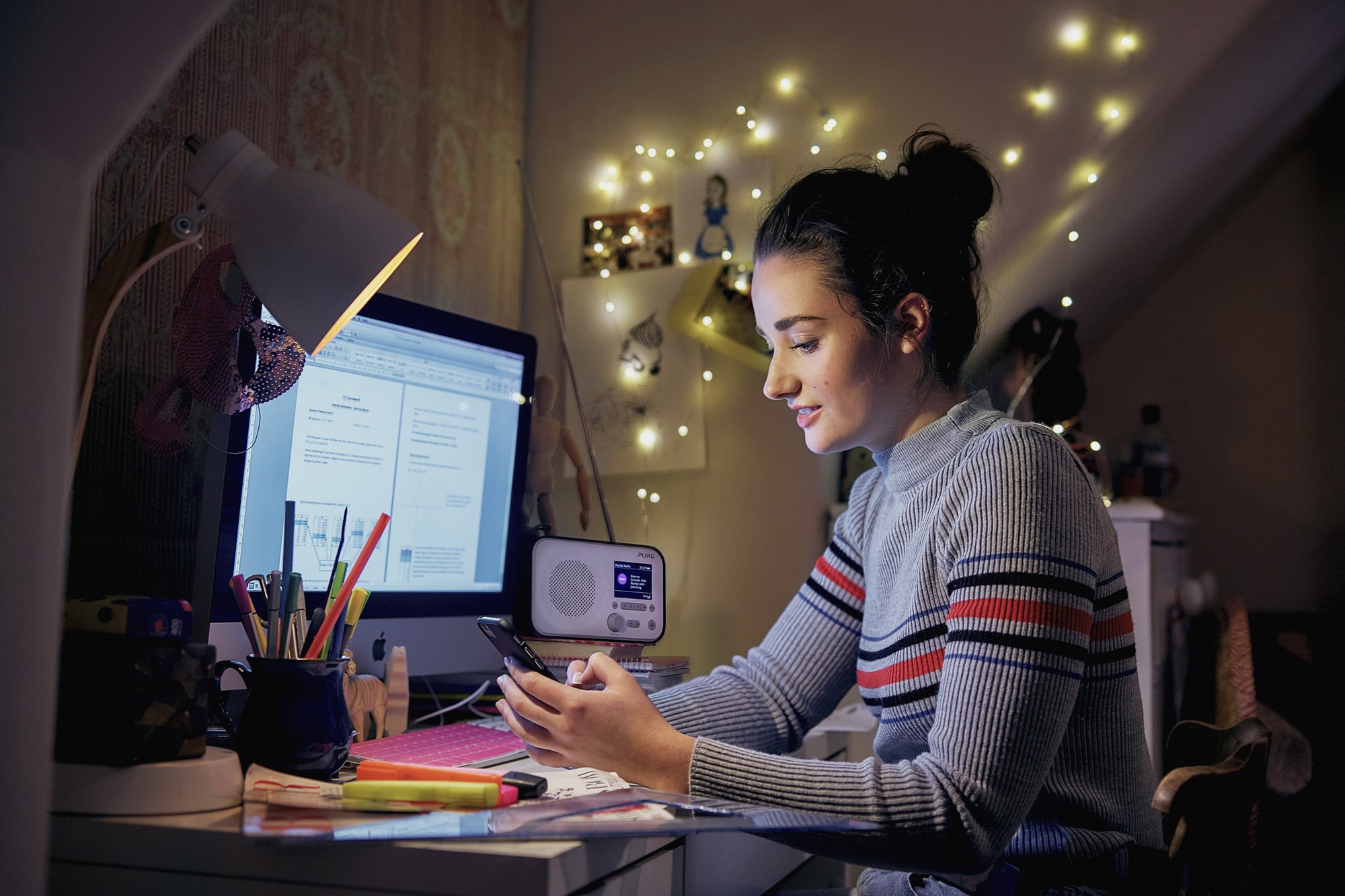 Generic image of young person sat at a computer